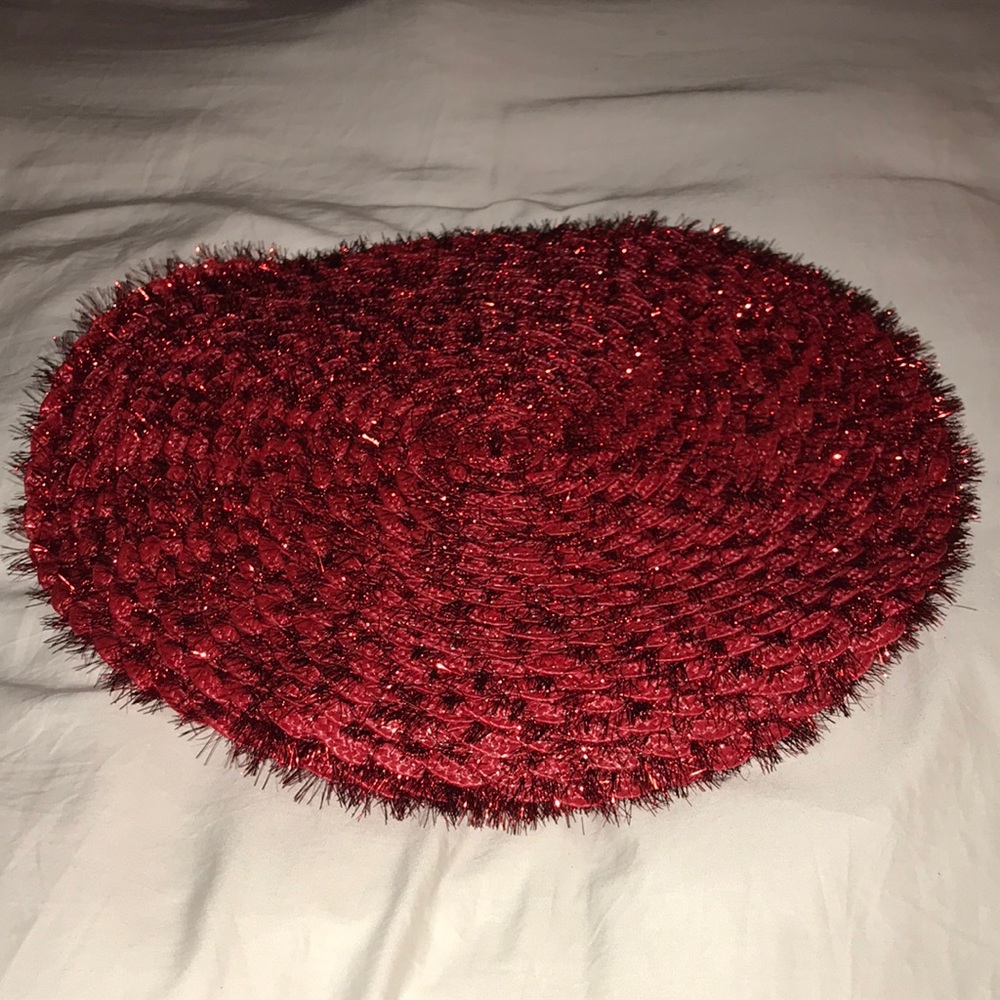 Four round red tinsel placements